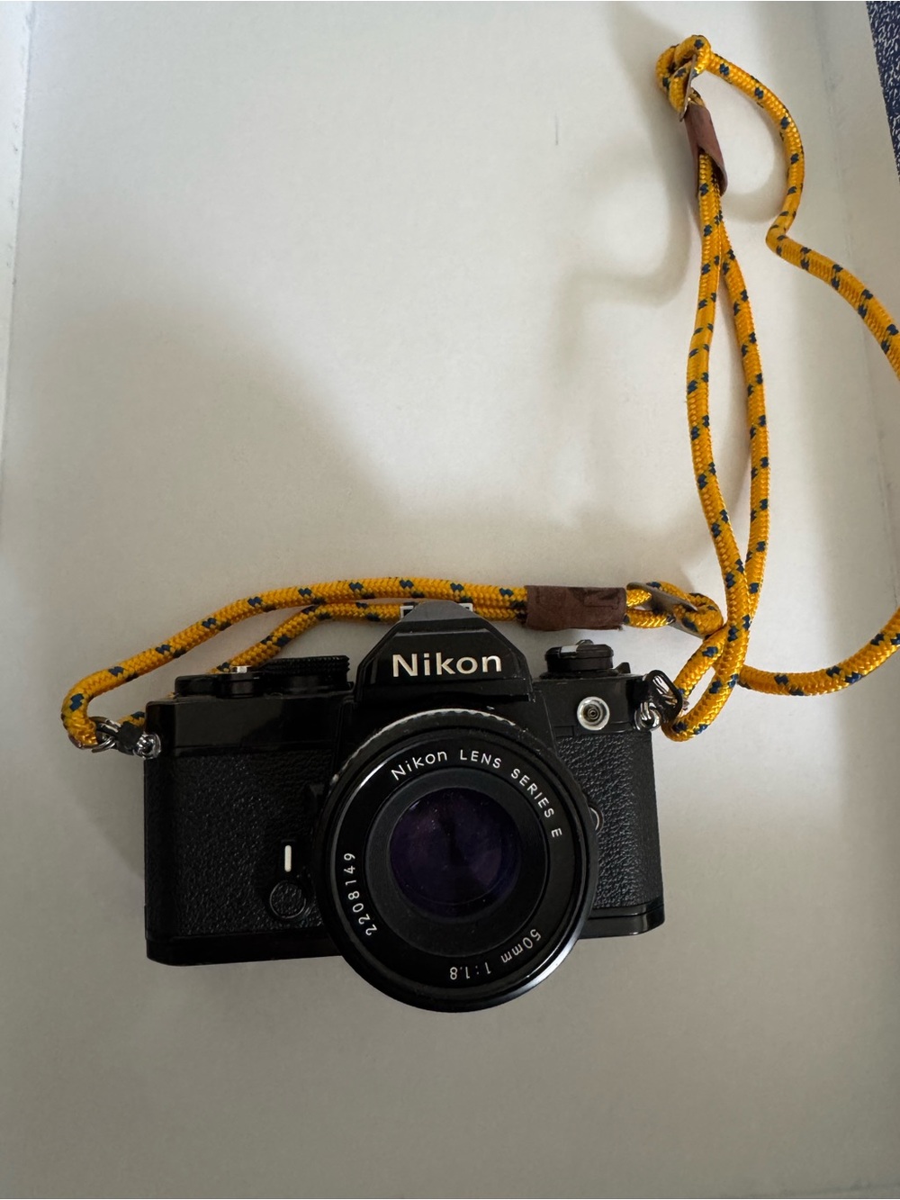 Nikon Black Film Camera with Yellow Rope Strap